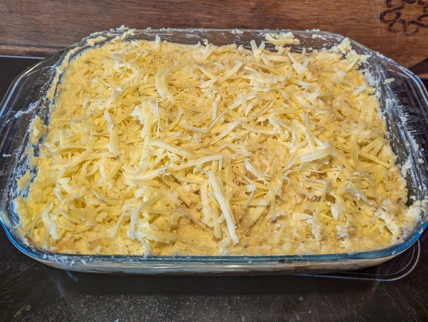 a casserole dish with cheese in it